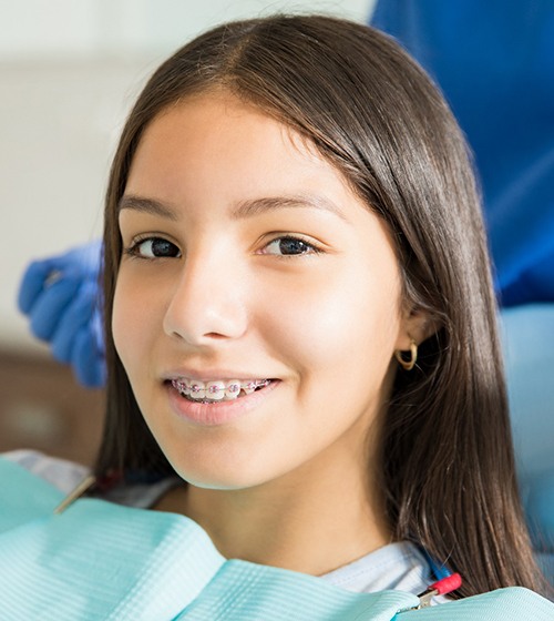 young girl smiling with braces