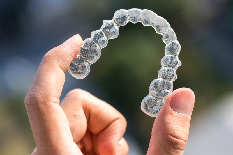 person wearing traditional braces